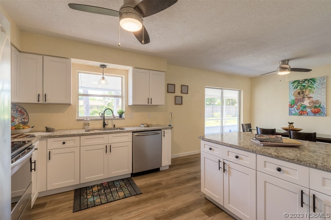 1851 Lime Tree Drive Edgewater, FL 32141 - Photo 11 of 25 a kitchen with granite countertop appliances cabinets and a sink