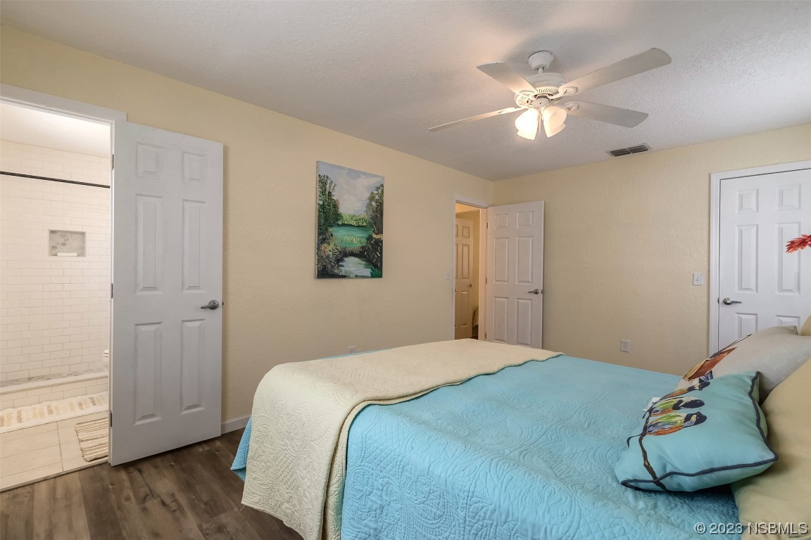 1851 Lime Tree Drive Edgewater, FL 32141 - Photo 14 of 25 a bedroom with a bed and wooden floor