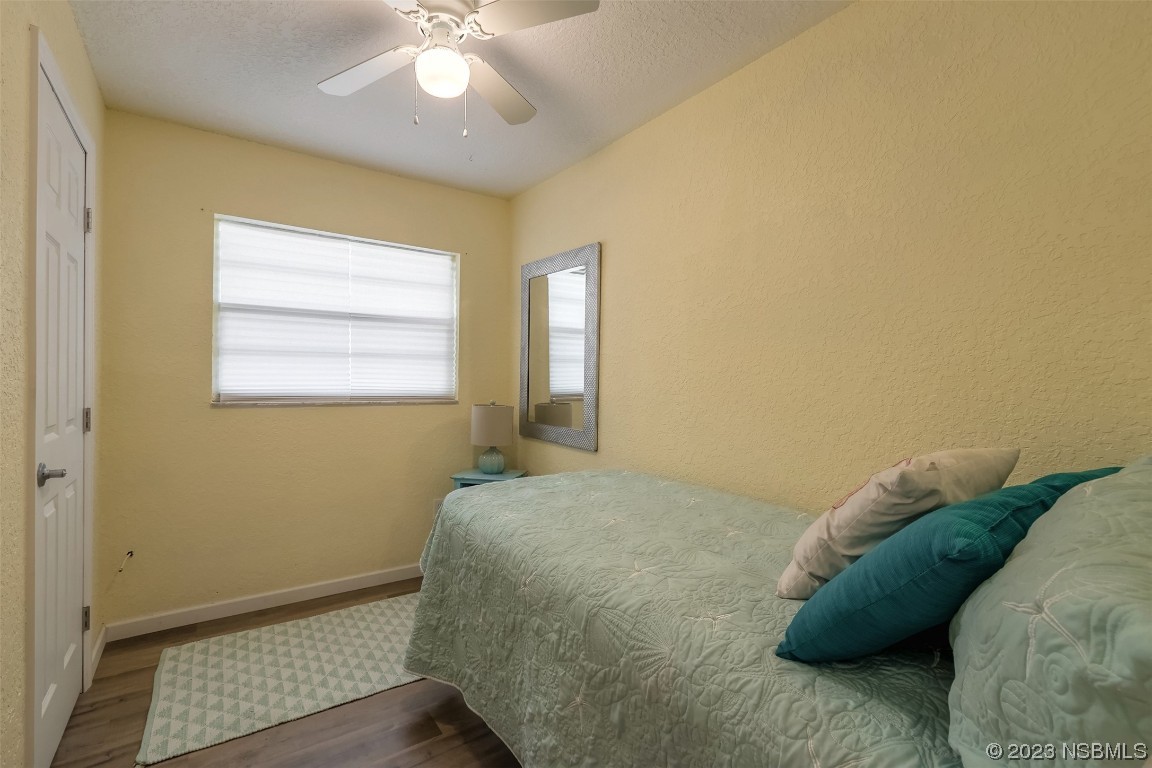 1851 Lime Tree Drive Edgewater, FL 32141 - Photo 18 of 25 a bedroom with a bed and a window