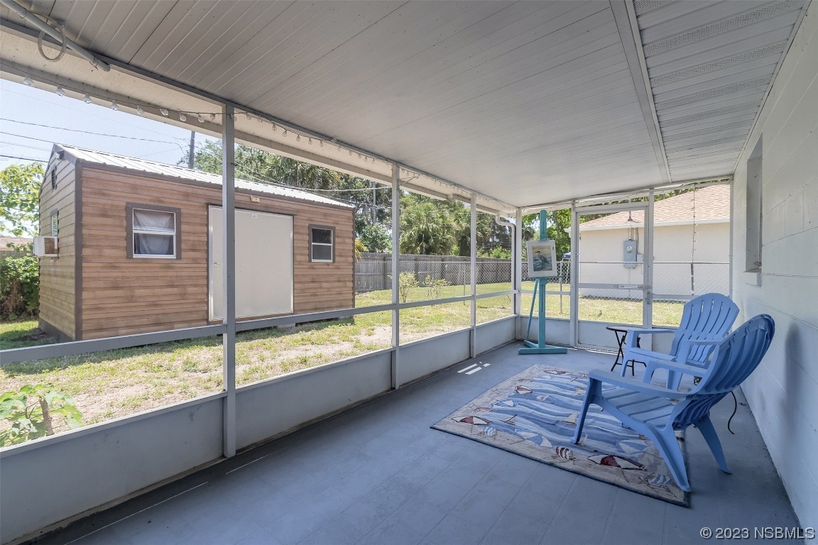 1851 Lime Tree Drive Edgewater, FL 32141 - Photo 19 of 25 a view of a living room and floor to ceiling window