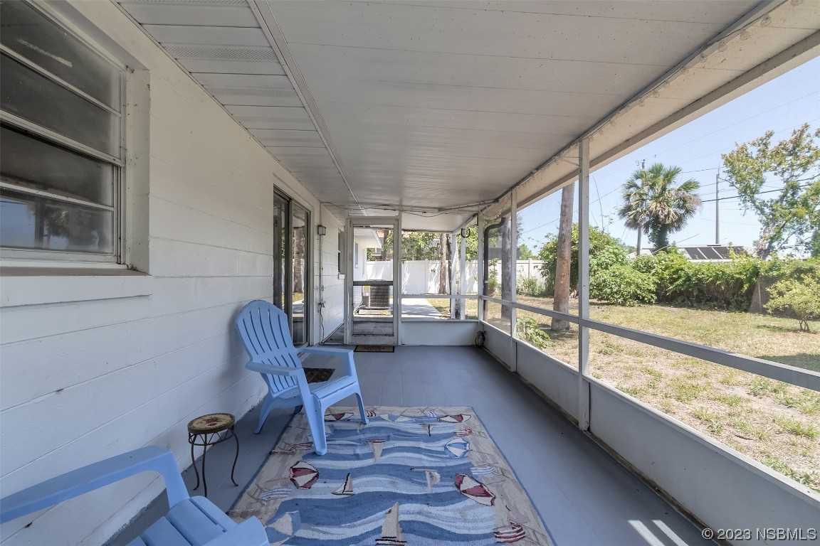1851 Lime Tree Drive Edgewater, FL 32141 - Photo 20 of 25 a view of a chairs and table in a patio