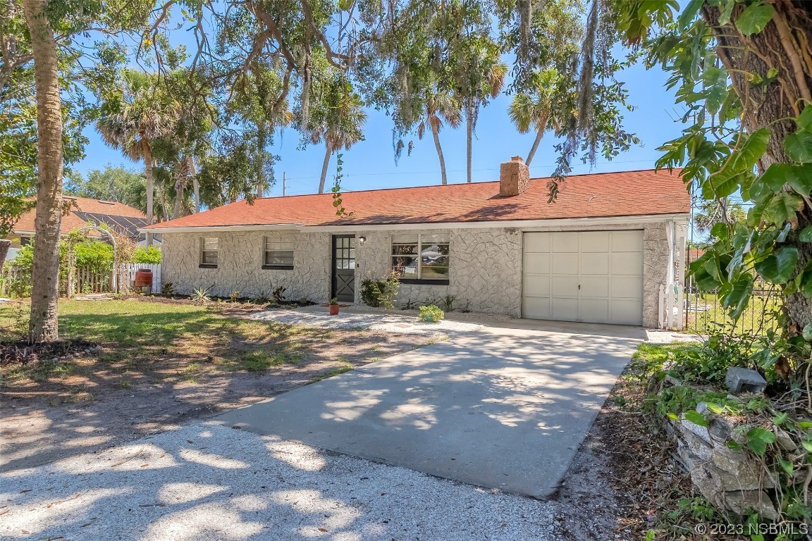 1851 Lime Tree Drive Edgewater, FL 32141 - Photo 3 of 25 a front view of a house with a tree