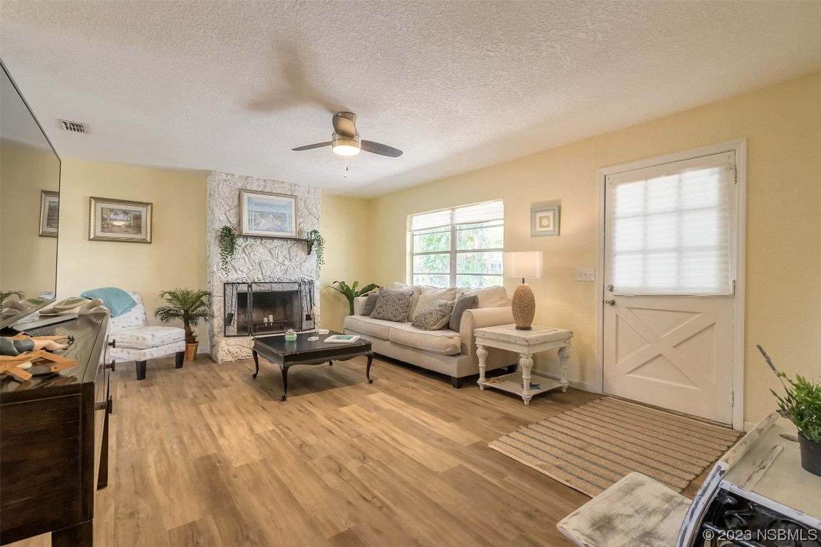 1851 Lime Tree Drive Edgewater, FL 32141 - Photo 4 of 25 a living room with furniture or couch and a fireplace