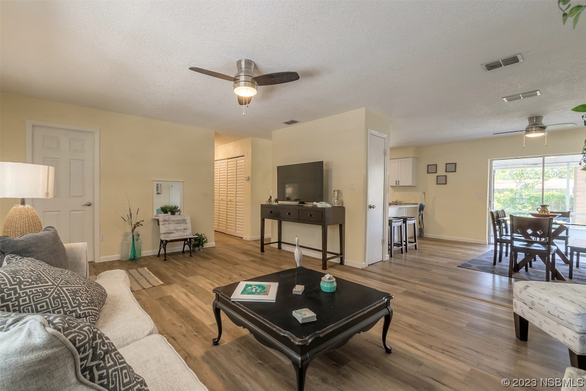 1851 Lime Tree Drive Edgewater, FL 32141 - Photo 6 of 25 a living room with furniture and a table