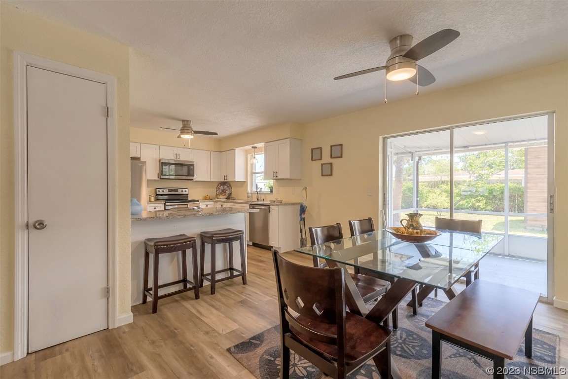 1851 Lime Tree Drive Edgewater, FL 32141 - Photo 7 of 25 a view of a dining room with furniture window and outside view
