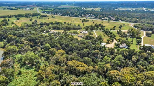 a living room with fireplace furniture and a flat screen tv