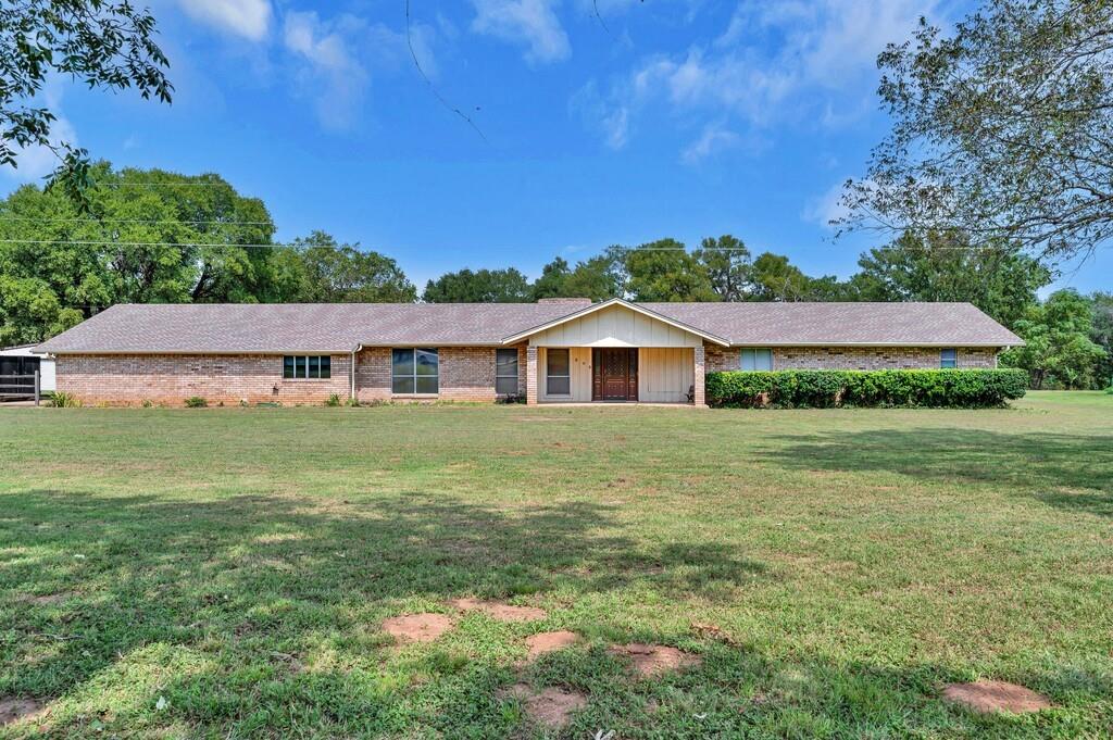 203 River Lane Waco, TX 76708 - Photo 21 of 40 a front view of a house with garden
