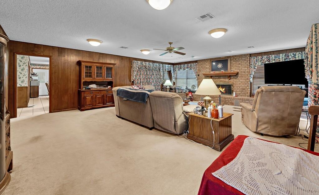 203 River Lane Waco, TX 76708 - Photo 22 of 40 a living room with furniture and a flat screen tv