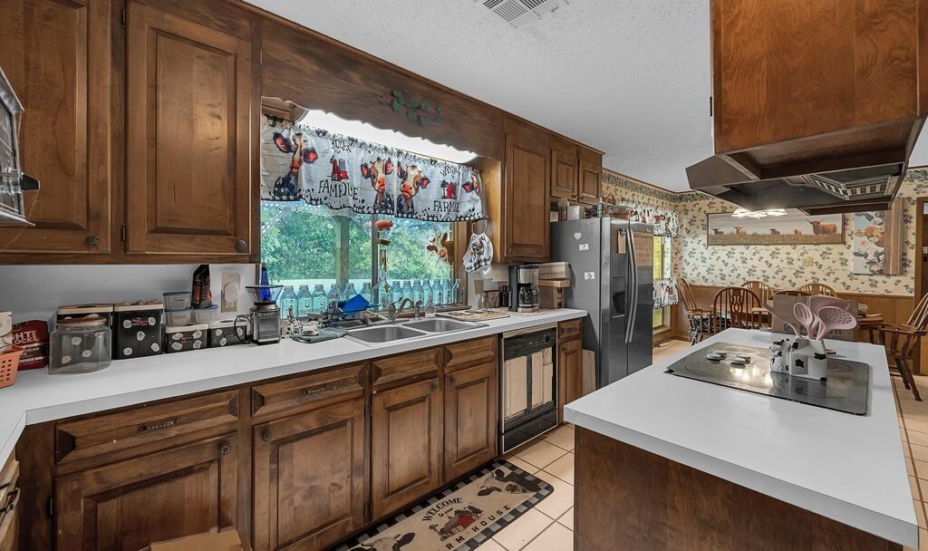203 River Lane Waco, TX 76708 - Photo 25 of 40 a kitchen with a sink stove and cabinets
