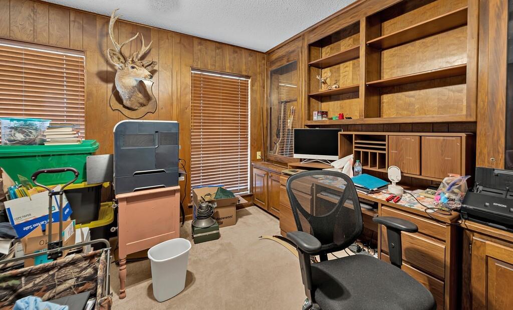 203 River Lane Waco, TX 76708 - Photo 32 of 40 a view of a workspace with furniture and a window