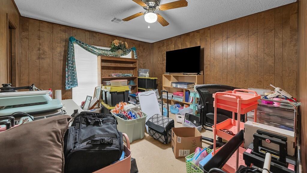 203 River Lane Waco, TX 76708 - Photo 35 of 40 a bedroom with furniture a flat screen tv and a window