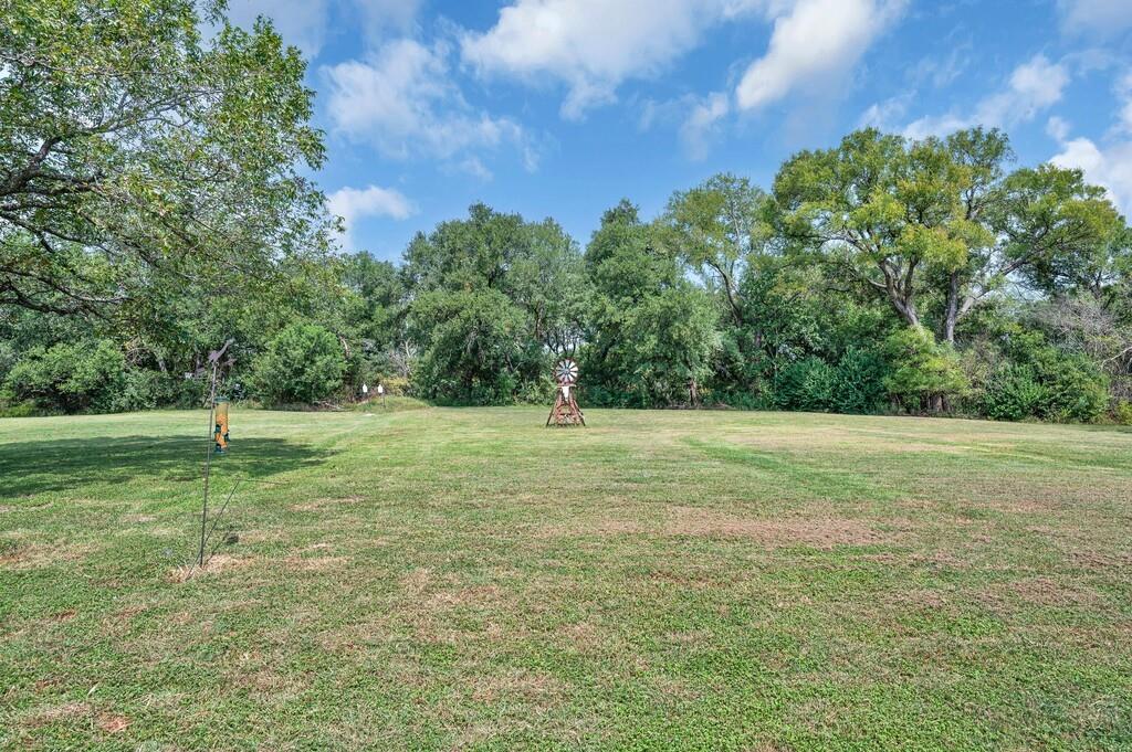 203 River Lane Waco, TX 76708 - Photo 37 of 40 a backyard of a house with lots of green space