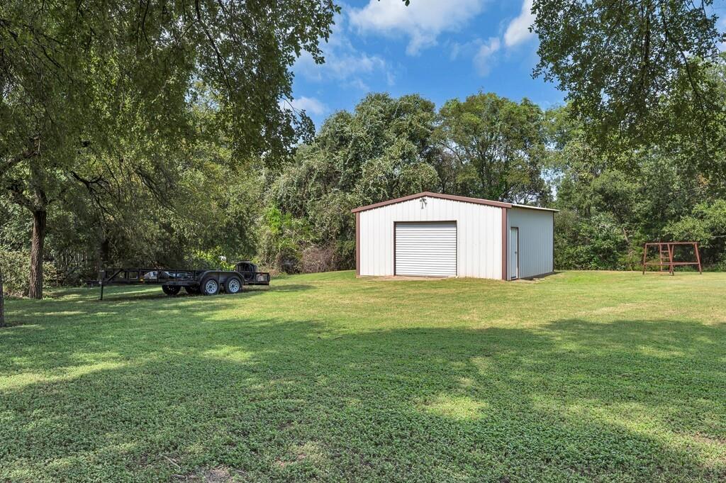203 River Lane Waco, TX 76708 - Photo 38 of 40 a backyard of a house with lots of green space
