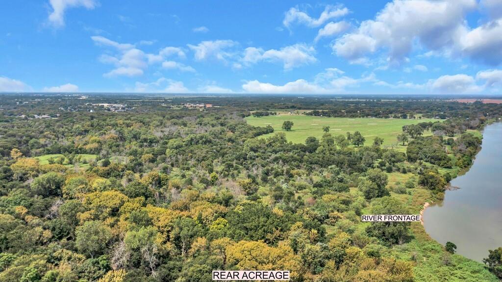 203 River Lane Waco, TX 76708 - Photo 4 of 40 a view of a city with lush green forest