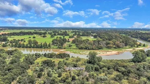 a view of a lake with houses in the back