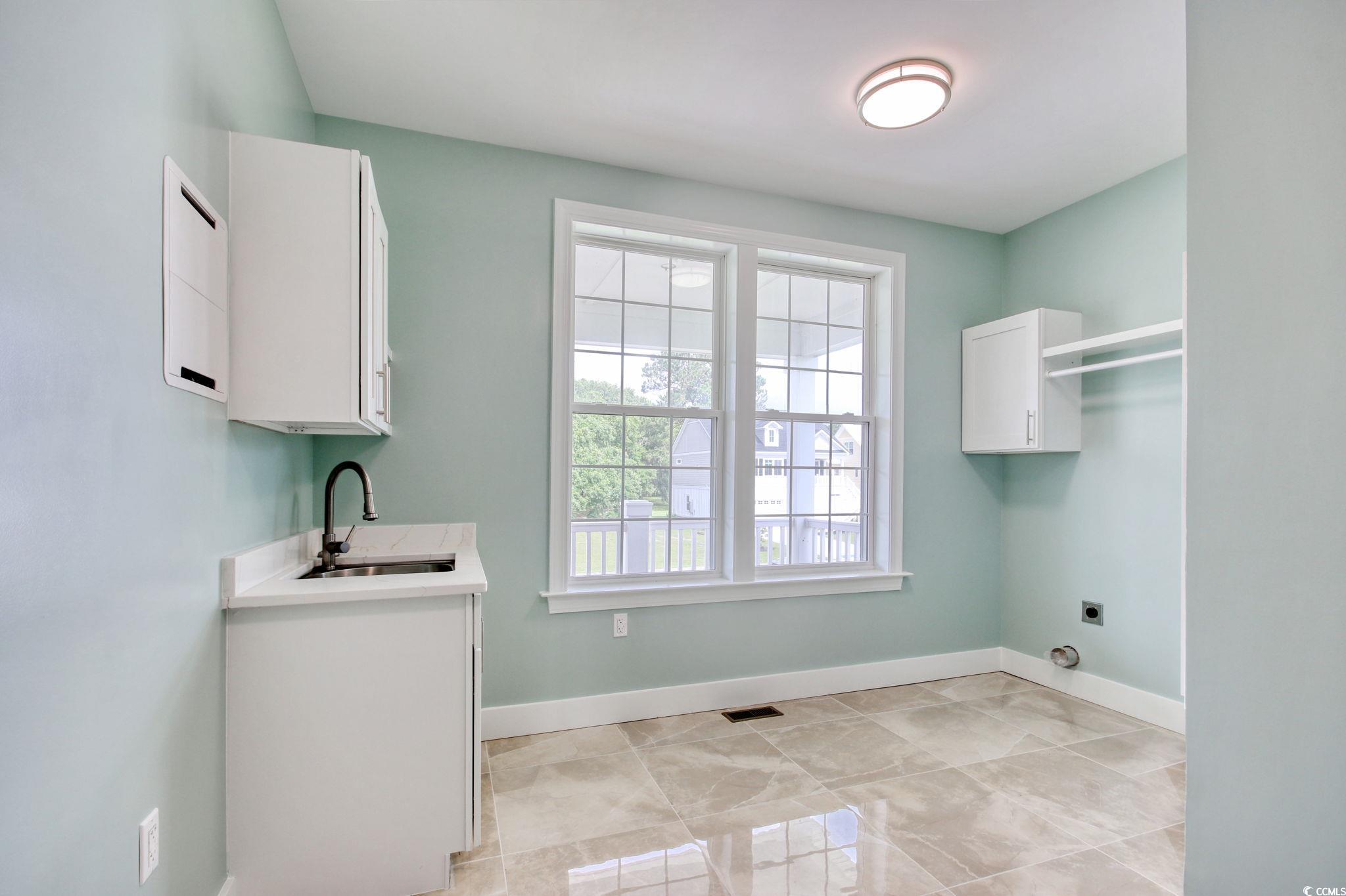 125 Oak Bay Drive Georgetown, SC 29440 - Photo 18 of 39 Washroom with cabinet space and hookup for an electric dryer