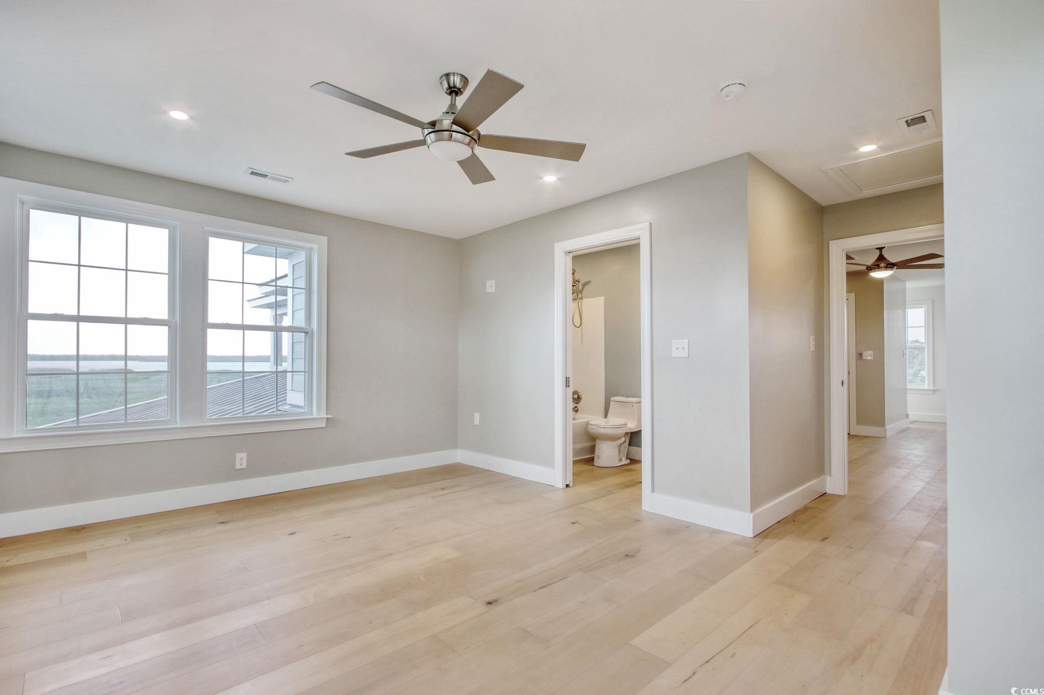 125 Oak Bay Drive Georgetown, SC 29440 - Photo 27 of 39 Spare room featuring ceiling fan, light wood-type flooring, recessed lighting, and attic access