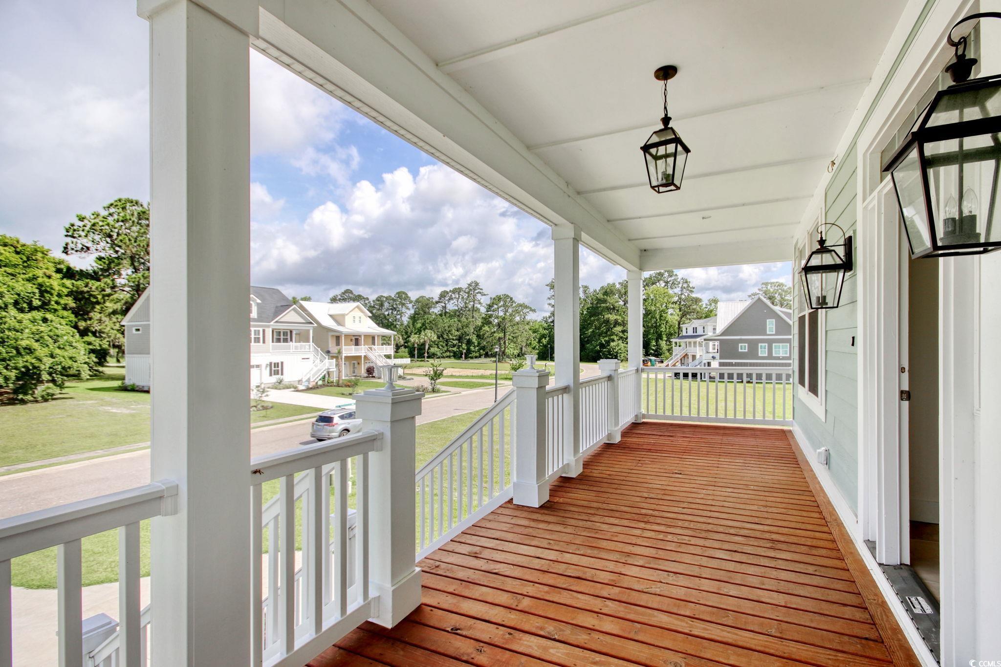 125 Oak Bay Drive Georgetown, SC 29440 - Photo 3 of 39 Wooden porch with a residential view