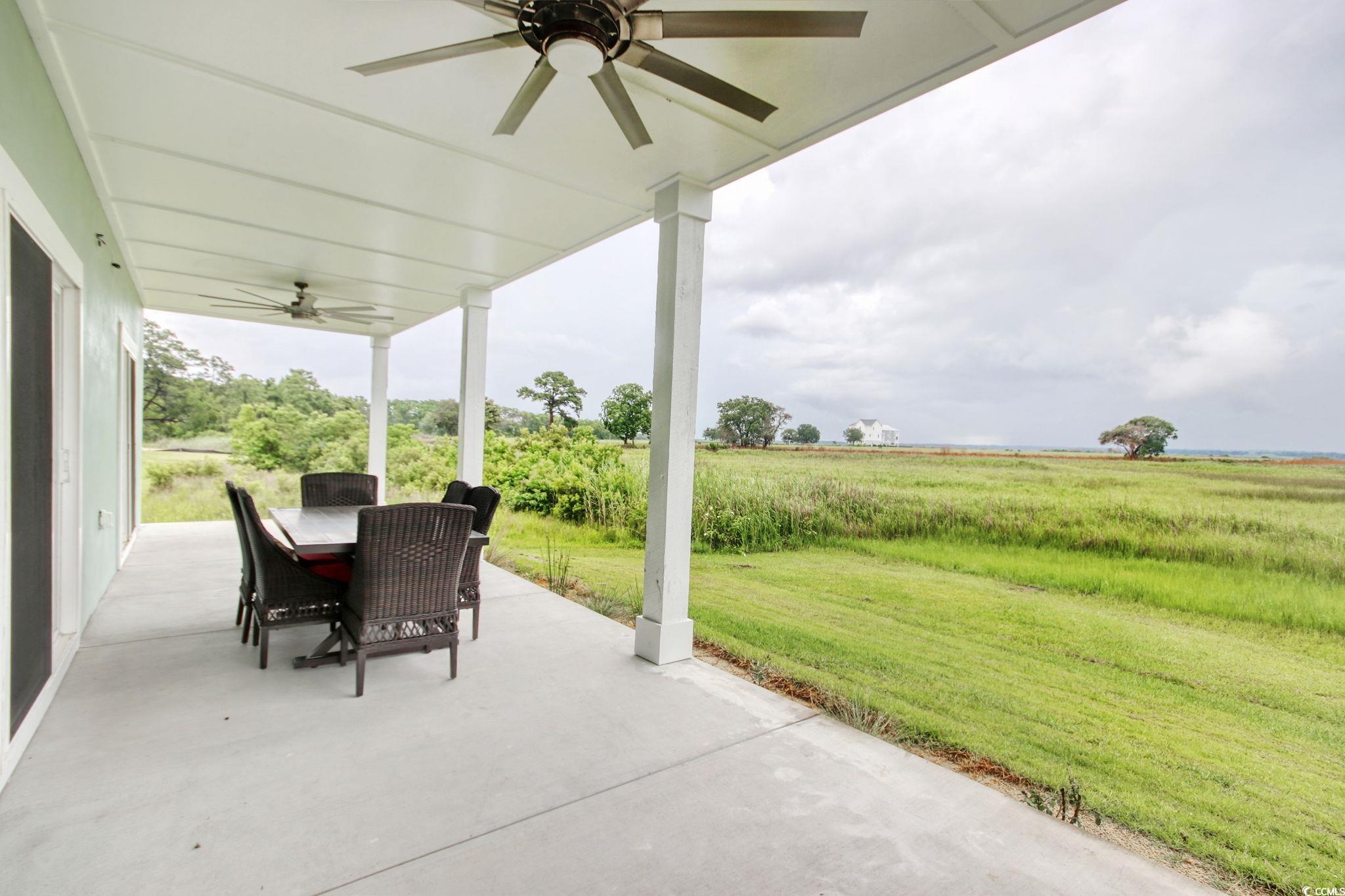 125 Oak Bay Drive Georgetown, SC 29440 - Photo 35 of 39 View of patio / terrace featuring ceiling fan and outdoor dining area