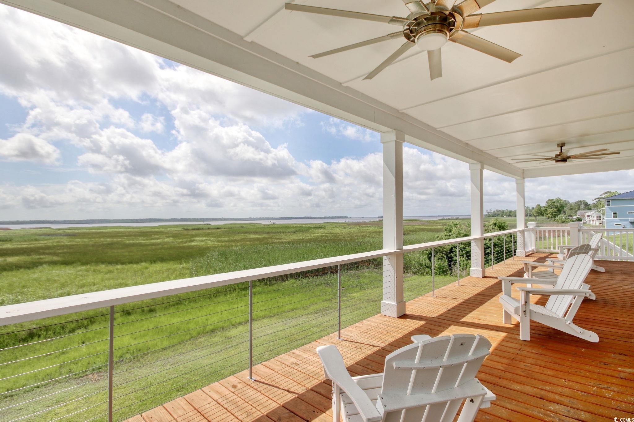 125 Oak Bay Drive Georgetown, SC 29440 - Photo 4 of 39 Wooden deck featuring a ceiling fan