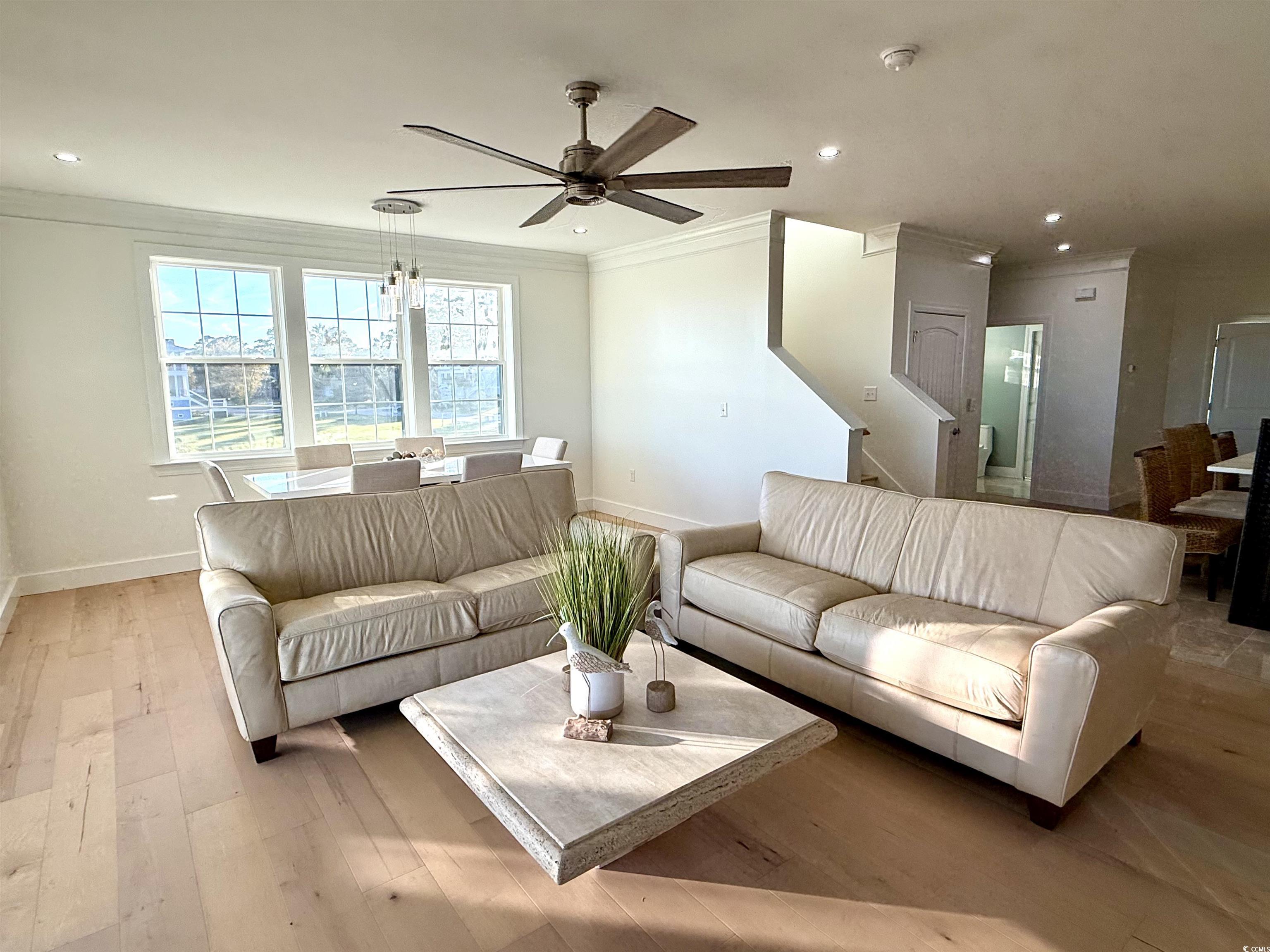 125 Oak Bay Drive Georgetown, SC 29440 - Photo 7 of 39 Living room featuring ornamental molding, recessed lighting, hardwood / wood-style floors, a ceiling fan, and stairway