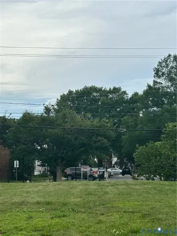 a view of building with outdoor space and garden
