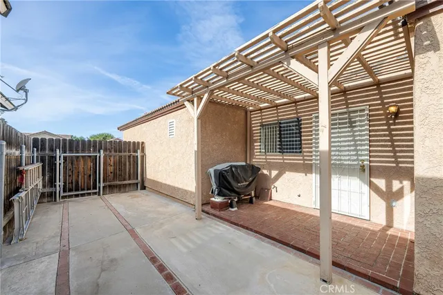 a view of backyard with tub and entertaining space