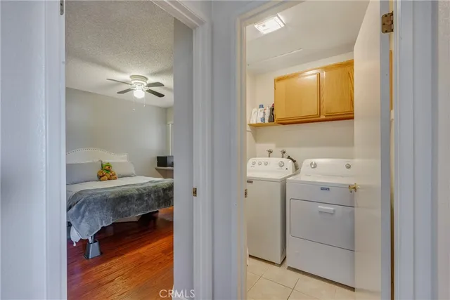 a bathroom with a double vanity sink mirror and shower
