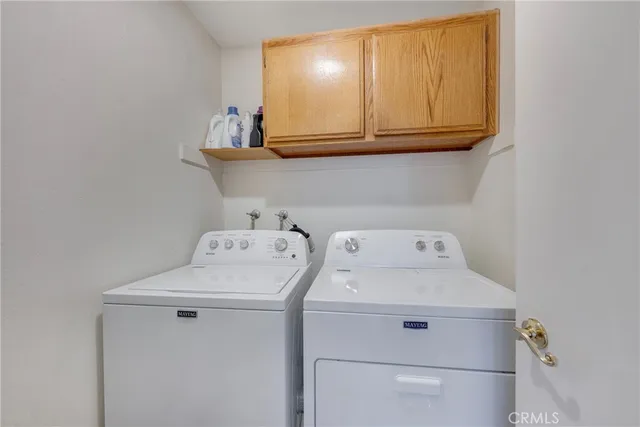 a en suite bathroom with a double vanity sink and a mirror
