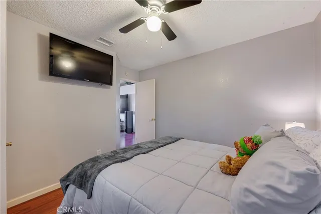 a bedroom with a bed and a mirror