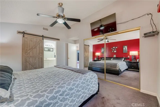 a view of a workspace with furniture and wooden floor