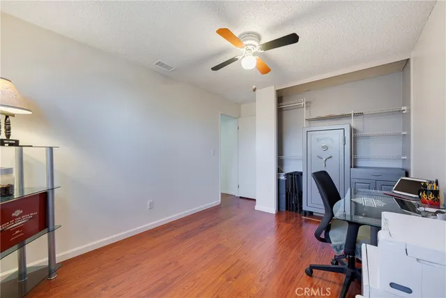 a picture of a room with a white wall and a large window