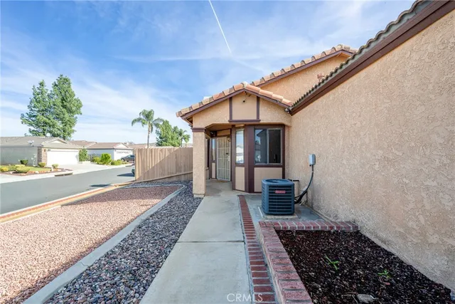 a view of backyard with a chair and a fireplace