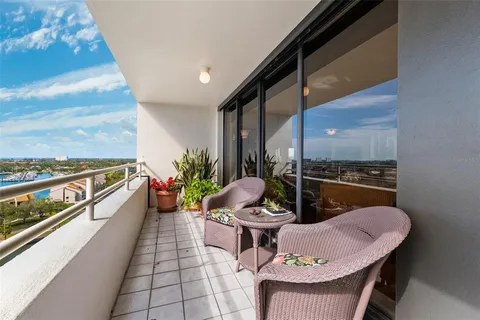 a kitchen with stainless steel appliances granite countertop a sink and a wooden floors