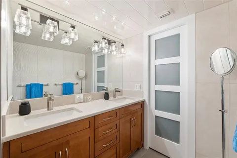 a bed room with a bed and a night stand