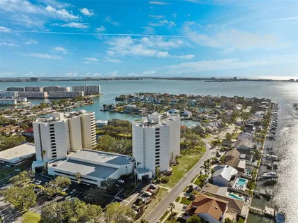a kitchen with stainless steel appliances kitchen island granite countertop a stove a sink and a microwave