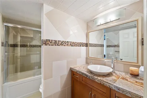 a bathroom with a toilet a sink and a bathtub