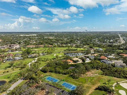 an aerial view of a city with lawn chairs