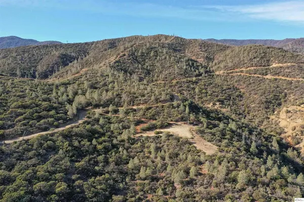 a view of a mountain range in a cloudy sky