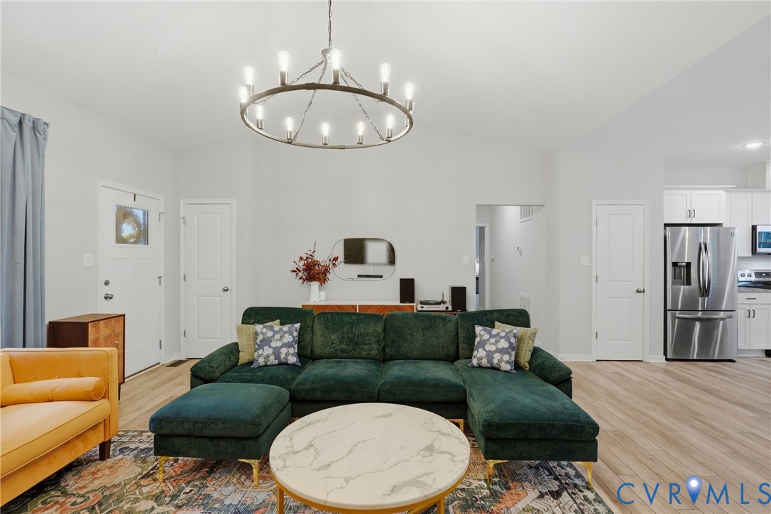 3741 Boundary Run Road Gum Spring, VA 23065 - Photo 6 of 36 Vaulted ceiling with a contemporary chandelier