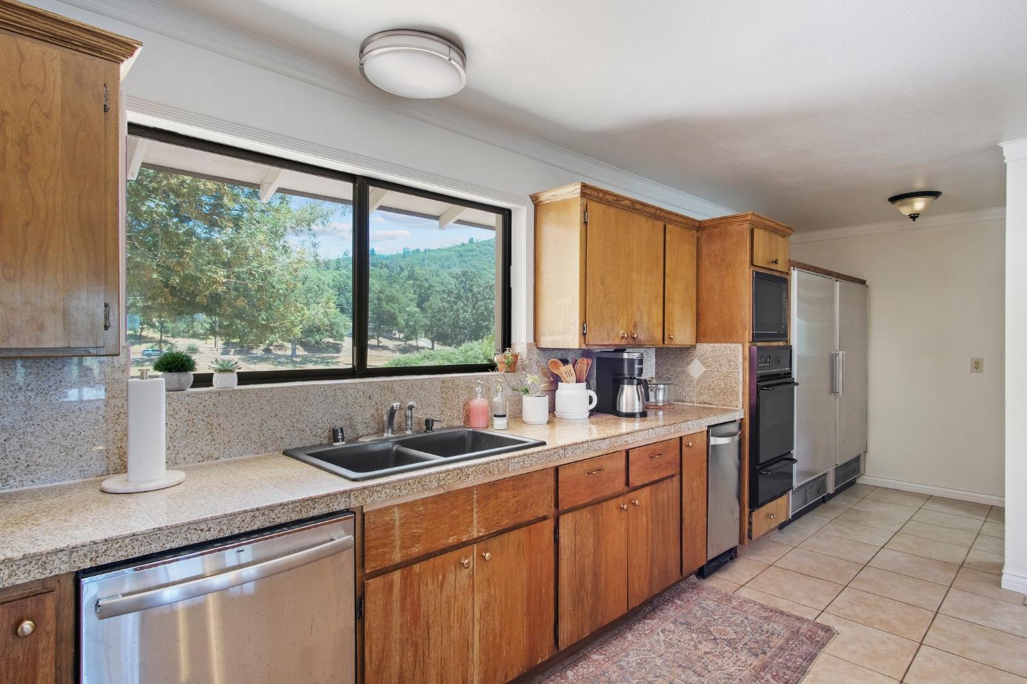 18950 Black Oak Road Sonora, CA 95370 - Photo 11 of 46 a kitchen with a sink and a window