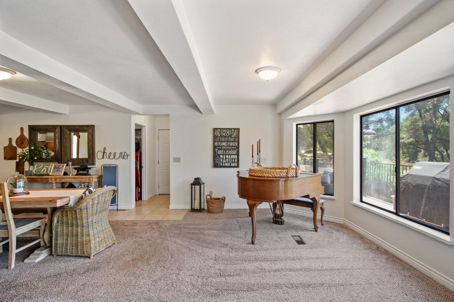 18950 Black Oak Road Sonora, CA 95370 - Photo 14 of 46 a living room with furniture a rug and a large window