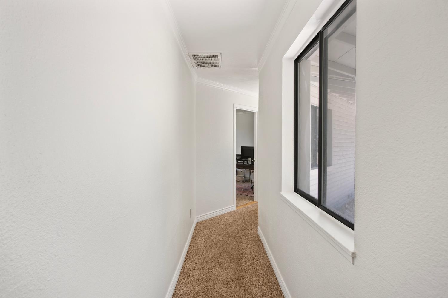 18950 Black Oak Road Sonora, CA 95370 - Photo 25 of 46 a view of a hallway with white walls