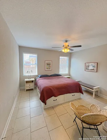 a bathroom with a double vanity sink a mirror a bathtub and shower