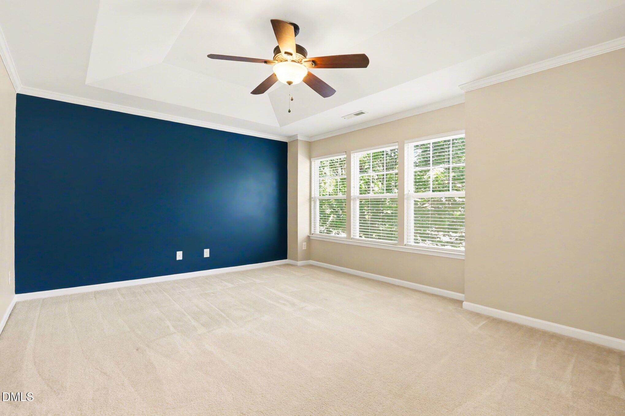 2409 Memory Ridge Drive Raleigh, NC 27606 - Photo 15 of 36 an empty room with a ceiling fan and a window