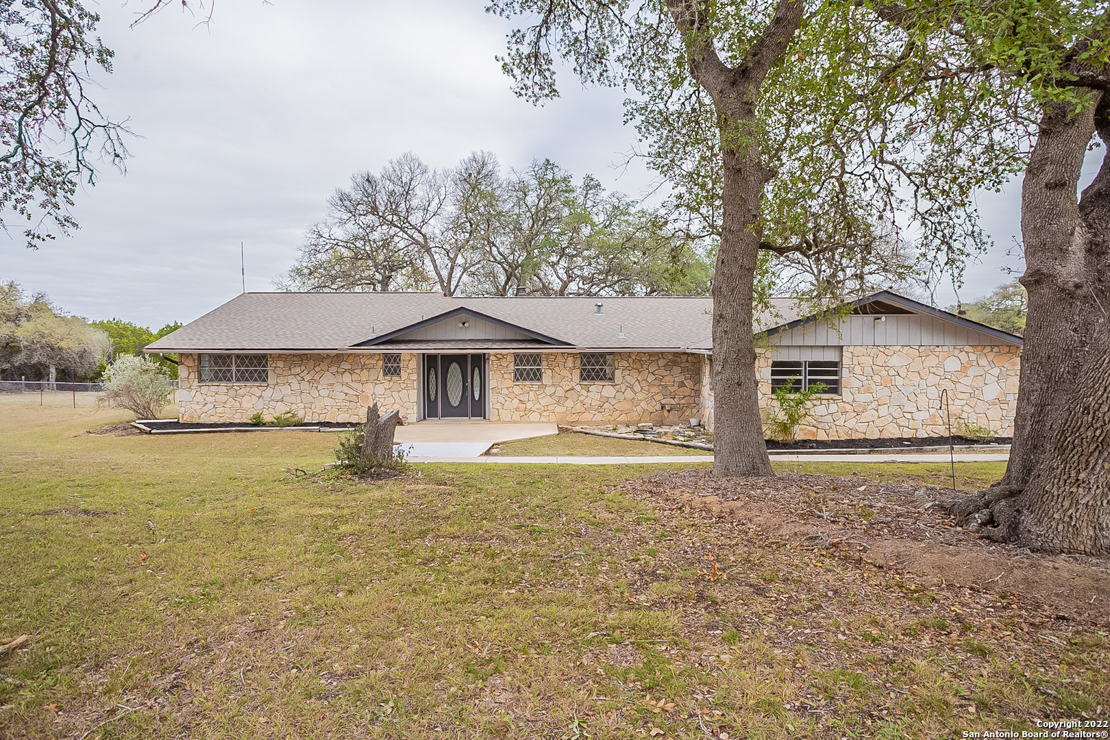 20 J Williams Road Boerne, TX 78006 - Photo 1 of 1 a house with trees in the background