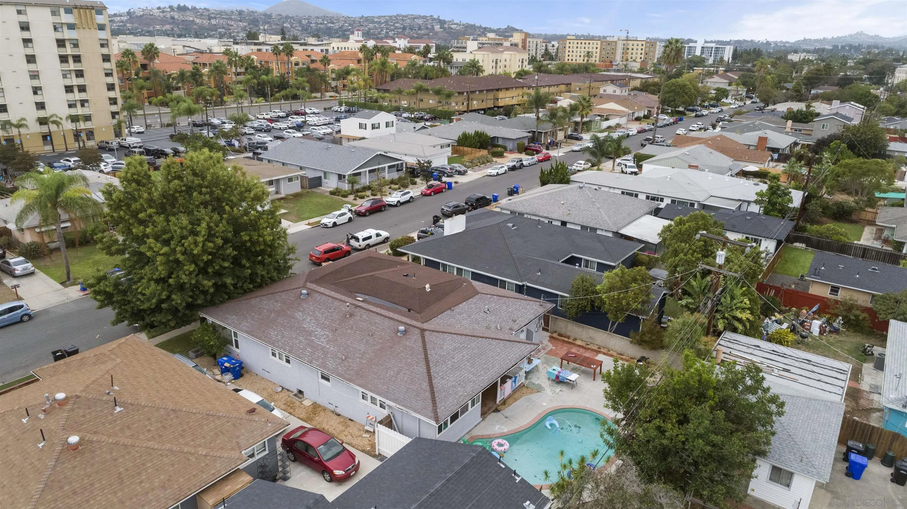 an aerial view of residential houses with outdoor space