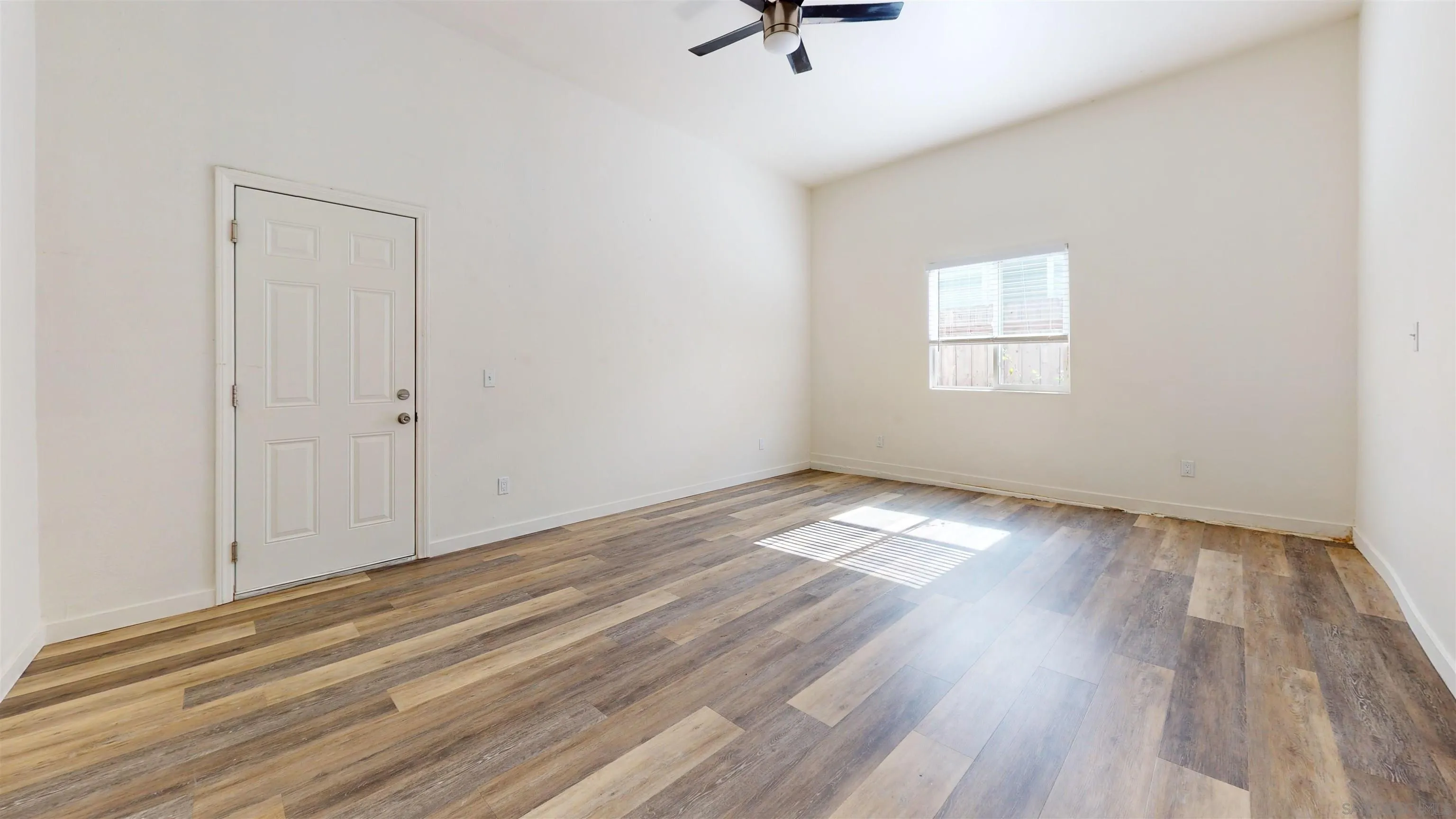 5555 Mary Ln Drive San Diego, CA 92115 - Photo 17 of 39 a view of empty room with wooden floor and fan