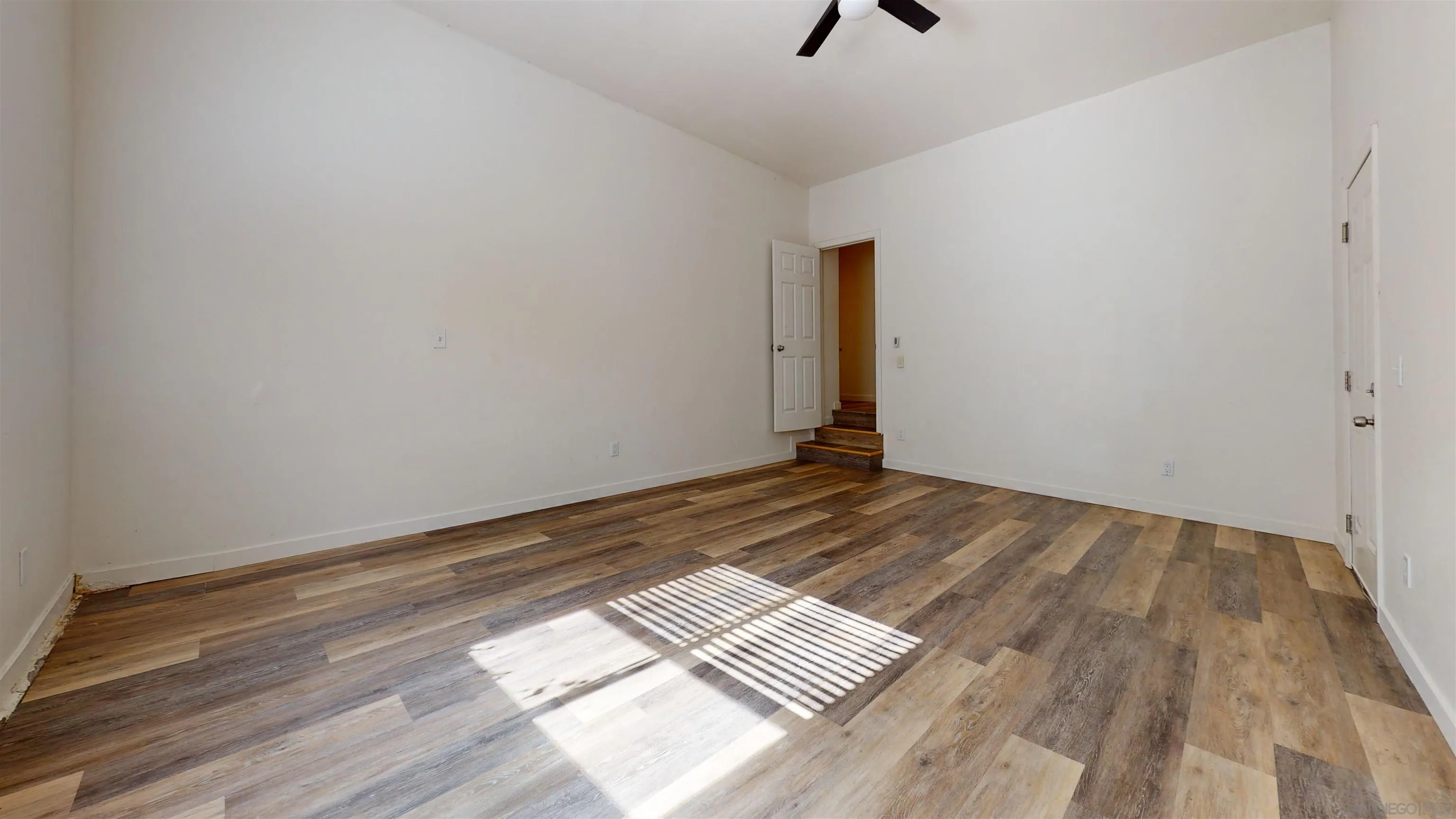 5555 Mary Ln Drive San Diego, CA 92115 - Photo 18 of 39 a view of a room with wooden floor