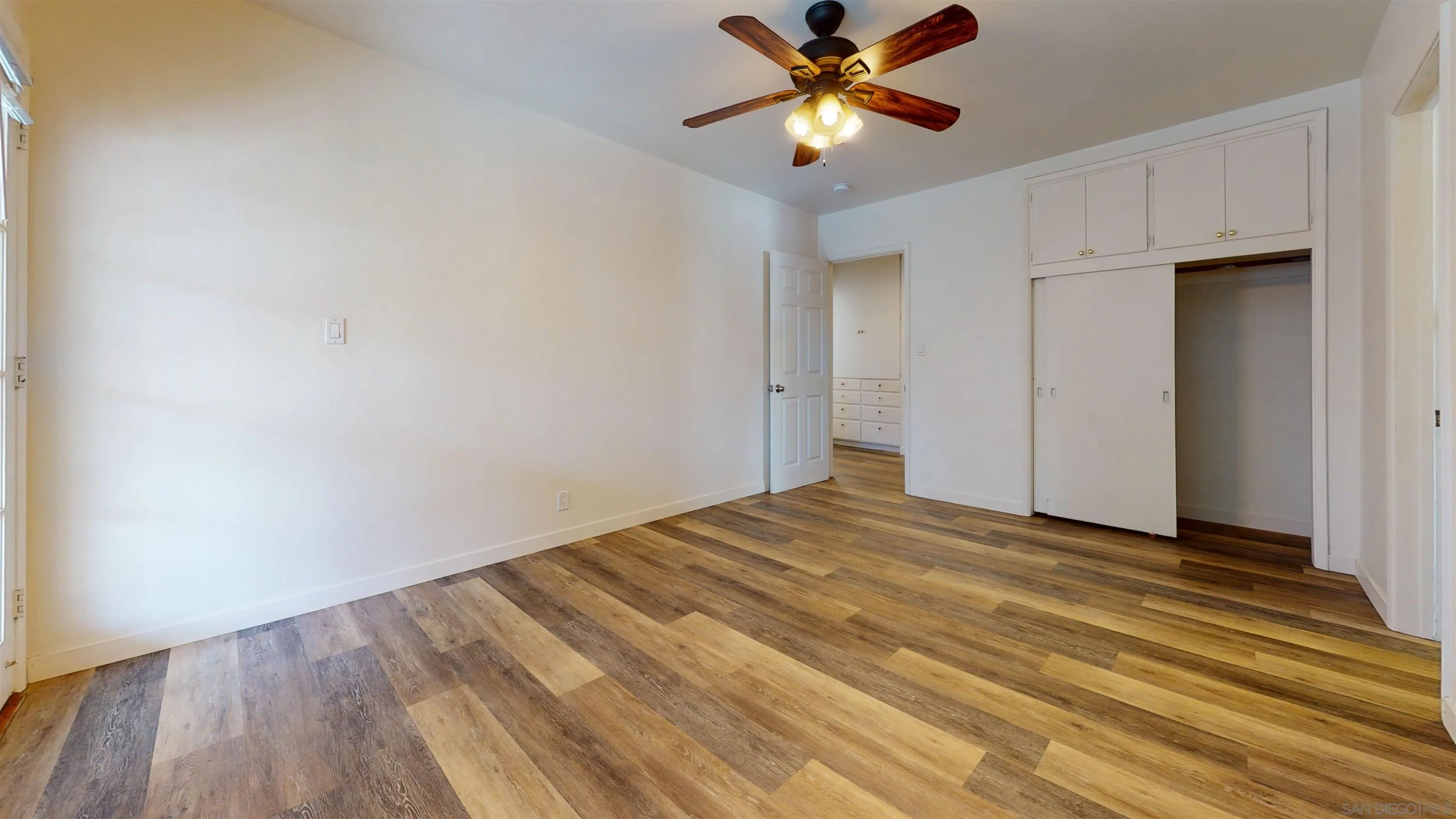 5555 Mary Ln Drive San Diego, CA 92115 - Photo 22 of 39 a view of empty room with wooden floor